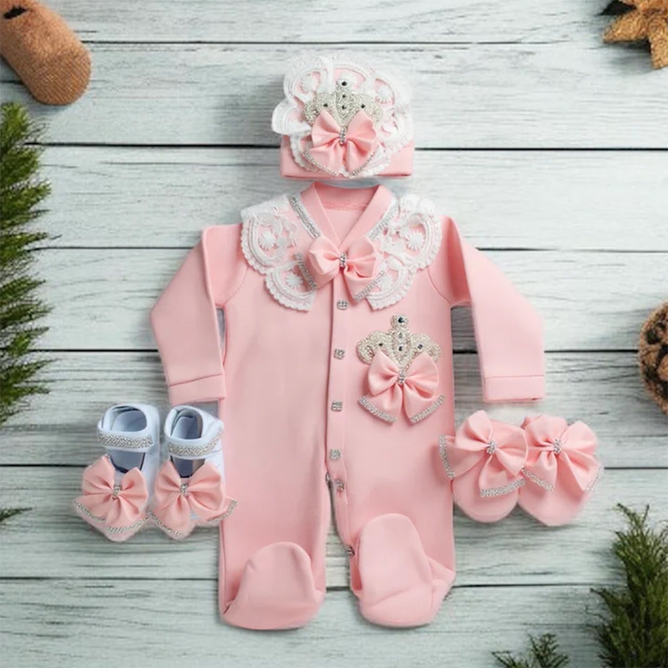Pink baby romper with lace, bows, and matching hat and shoes for newborns