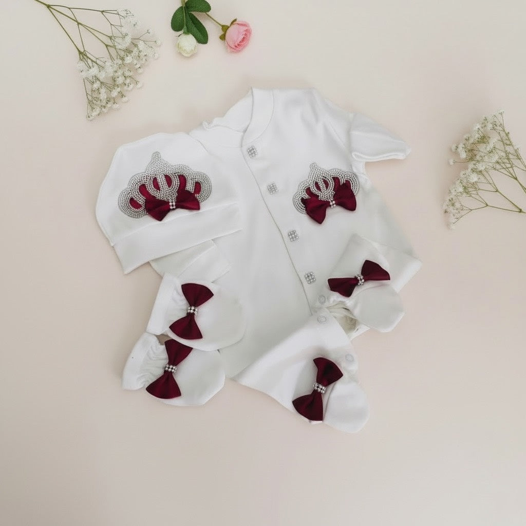 Luxury white baby romper set with burgundy bows and pearl details, perfect for newborns