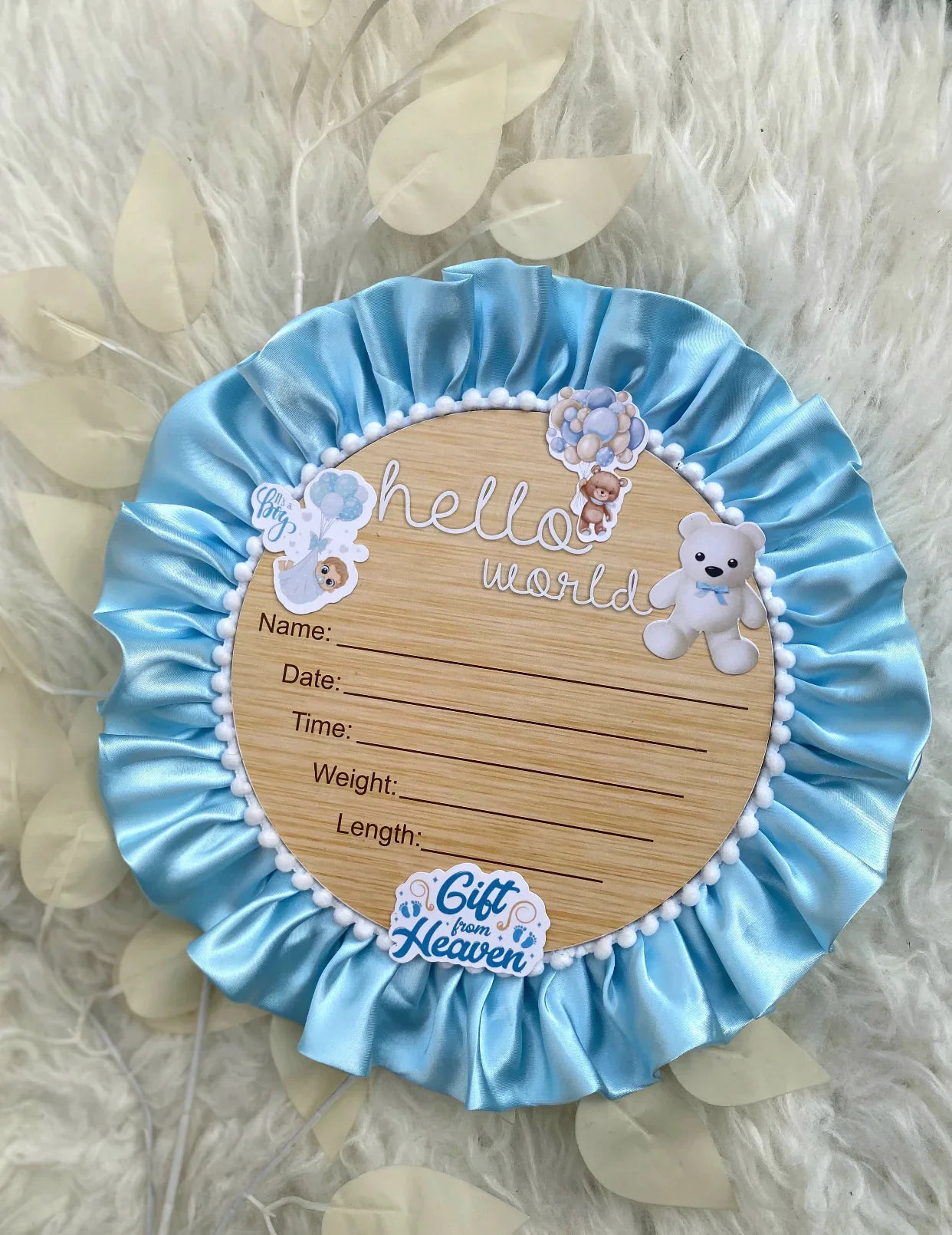 Blue satin baby announcement plaque with teddy bear, 'Hello World' text, and birth details for newborn boys
