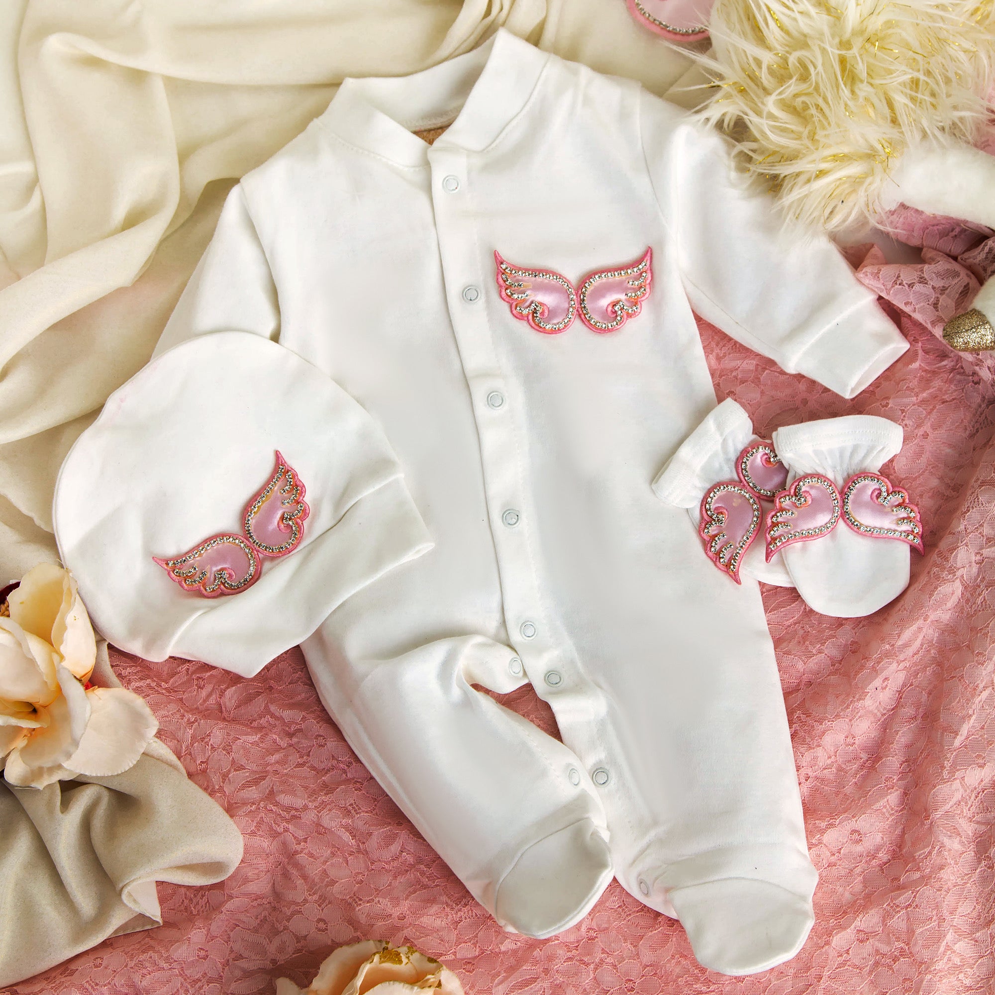 White baby romper set with pink angel wings, matching hat and booties, luxury newborn clothes