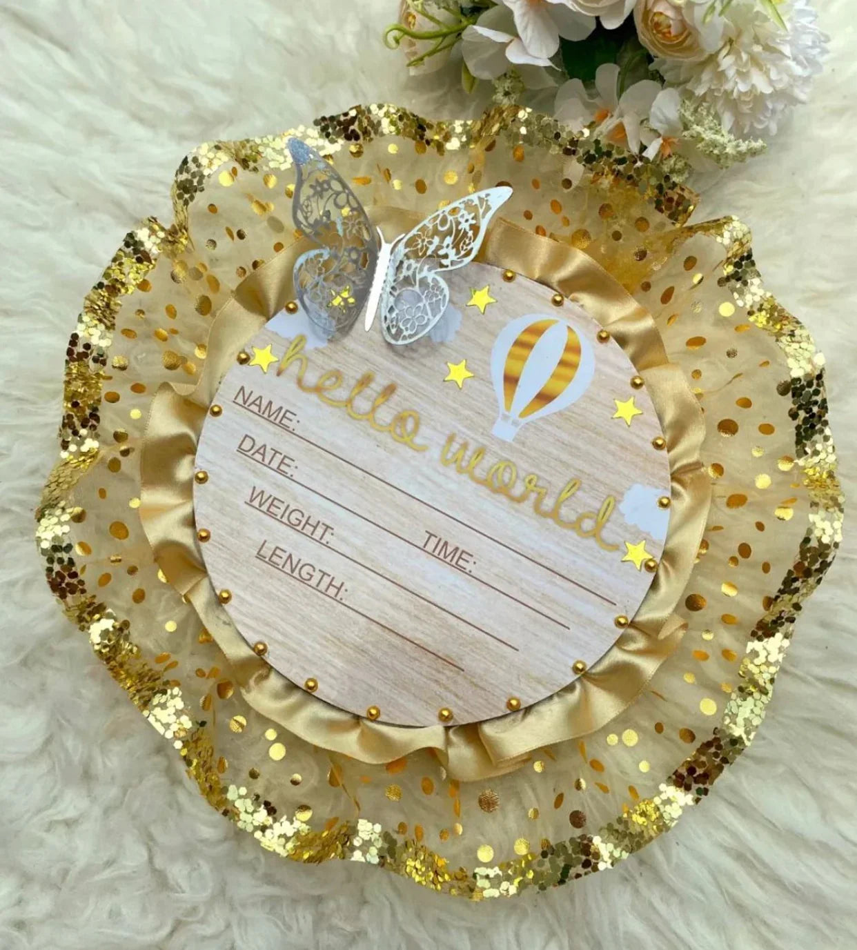 Hello World baby announcement card with gold glitter, butterflies, and hot air balloon design