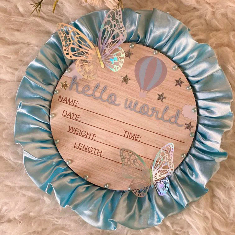 Hello World baby announcement plaque with butterflies, hot air balloon, and satin ruffle border